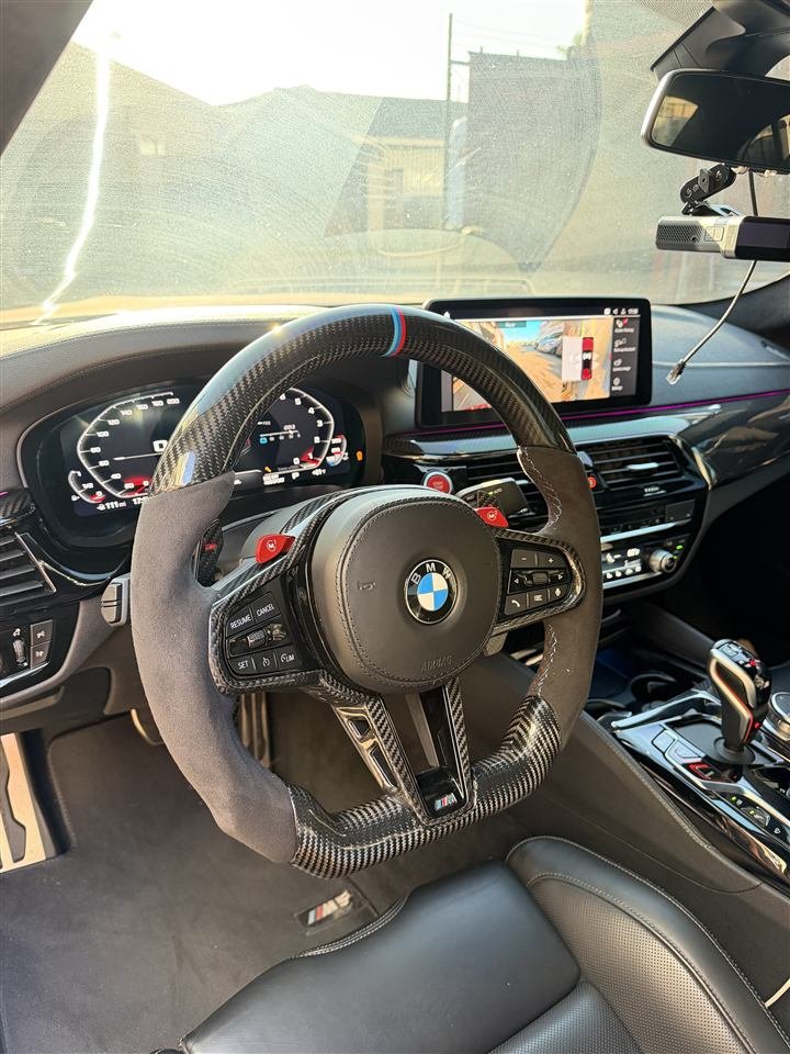 BMW interior with the dashboard lit up
