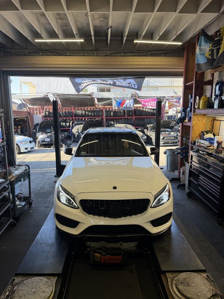 White Mercedes-Benz in a service bay